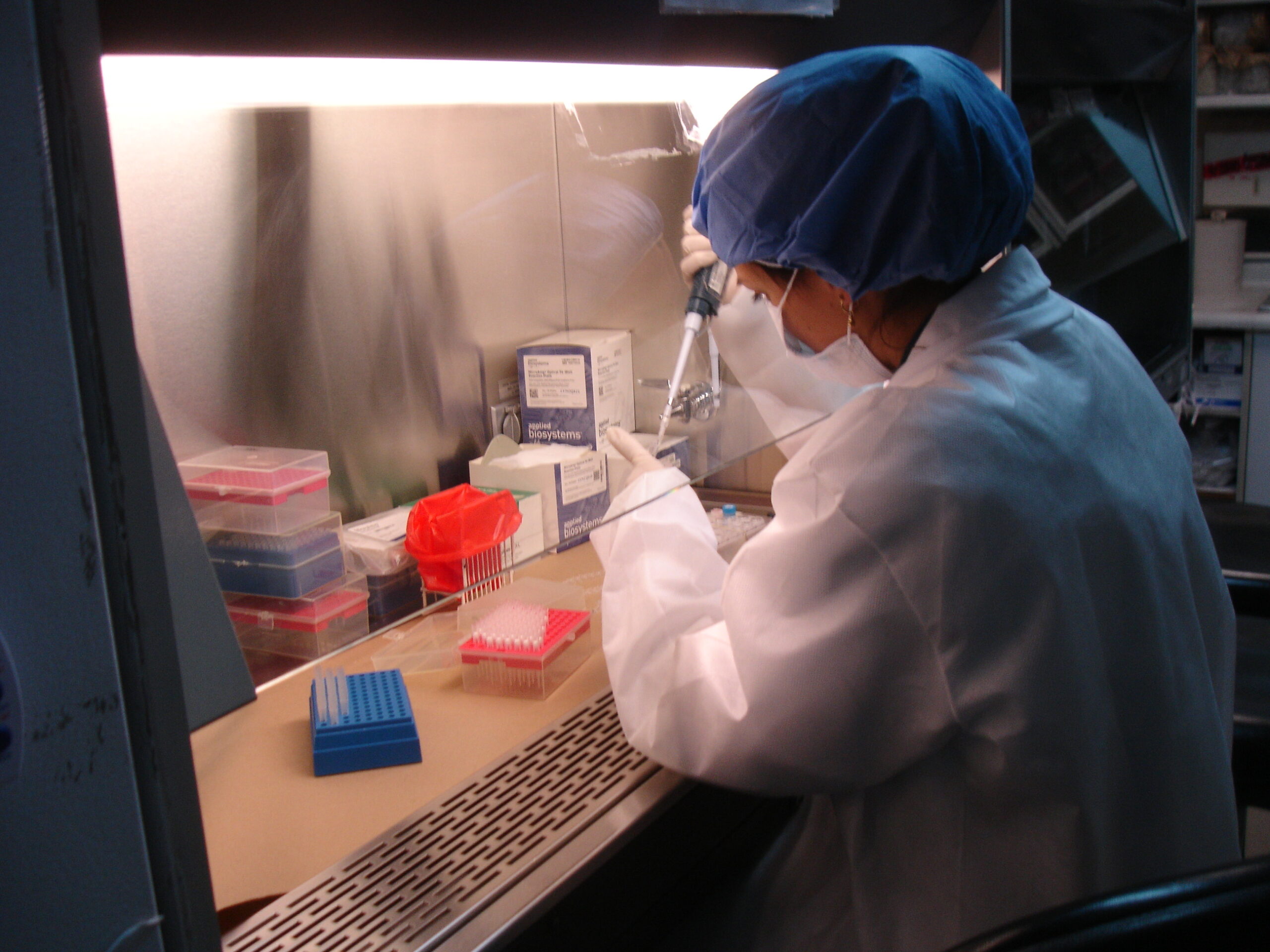 Photo of Scientist Performing Tests in a Lab